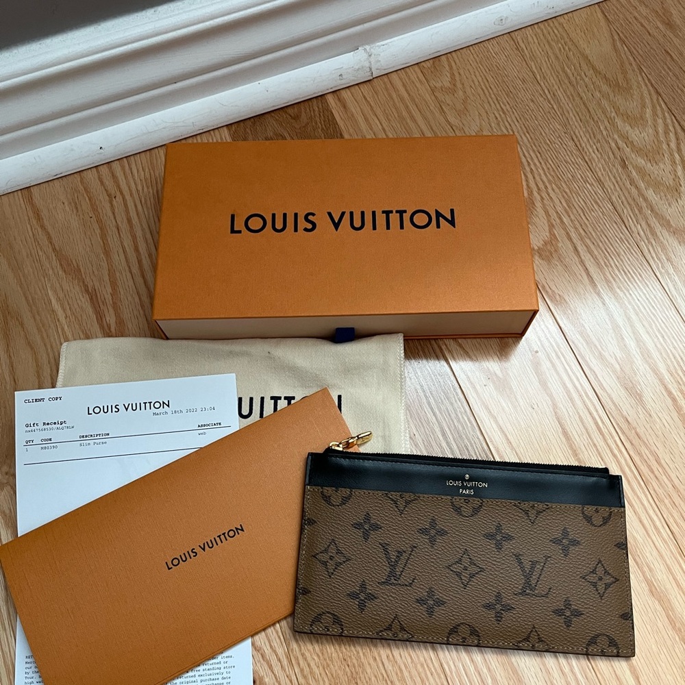 $ 6️⃣0️⃣0️⃣ Louis Vuitton Slim Purse Reverse Monogram